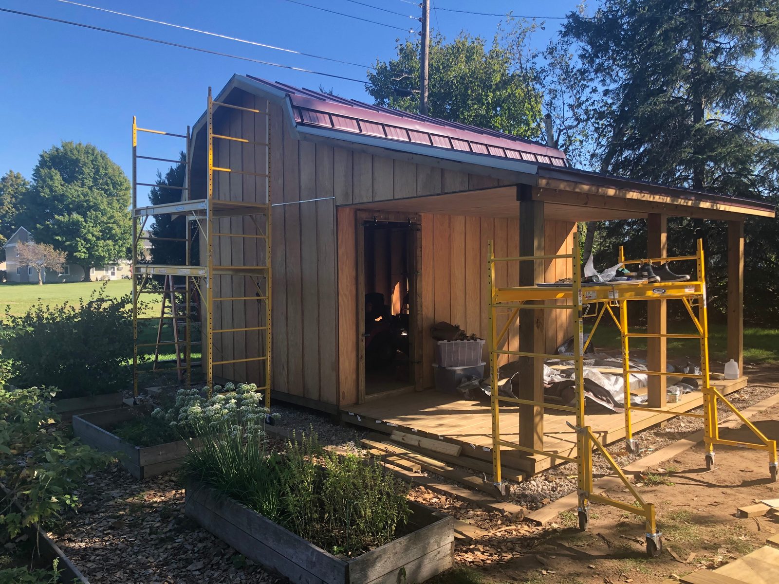 Barn-style shed with covered porch