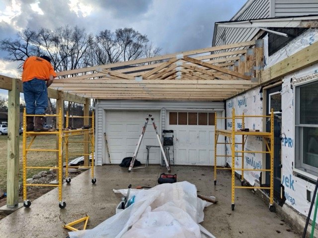 Carport roof trusses being framed