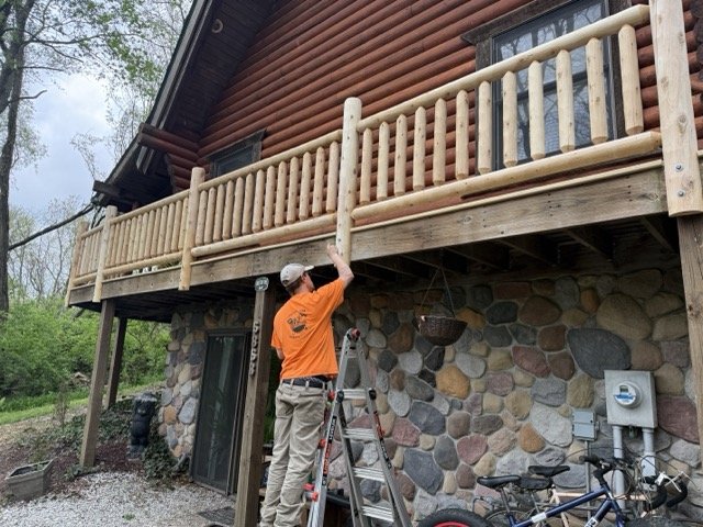 Log railing on a cabin deck